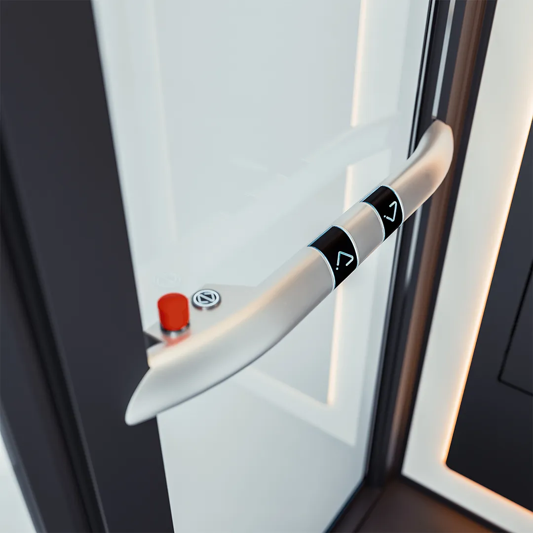 Detail handrail dan tombol stop darurat pada lift rumah Ascenda untuk mendukung keamanan pengguna saat berada di dalam kabin.